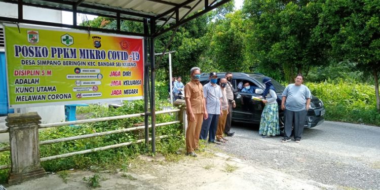 Personil Polsek Bandar Sei Kijang Cek Posko PPKM di Sejumlah Desa Wilayah Hukum