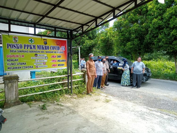 Personil Polsek Bandar Sei Kijang Cek Posko PPKM di Sejumlah Desa Wilayah Hukum