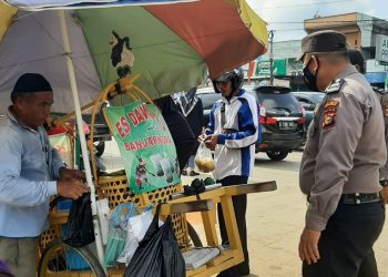 Sasar Keramaian, Polsek Ukui Imbau Masyarakat Patuhi Prokes Covid-19