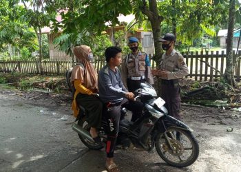 Polsek Teluk Meranti Pelalawan Sosialisasi Prokes dan Data Warga yang Tak Pakai Masker