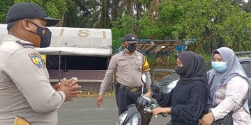 Lindungi Masyarakat dari Paparan Covid-19, Kapolsek Kerumutan Kerahkan Personil Lakukan Operasi Yustisi
