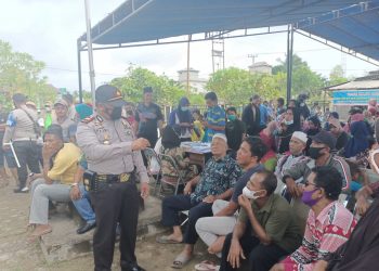 Polsek Kerumutan Berikan Himbauan Prokes saat Kegiatan Vaksinasi