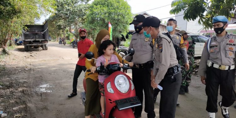 Kapolsek Teluk Meranti Lakukan Imbauan ‘Ayo Vaksin’ di Wilayah Binaannya