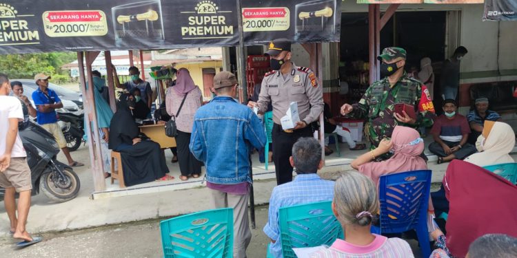 Jelang Akhir Tahun, Polsubsektor Pelalawan Bantu Pemerintah Genjot Capaian Vaksinasi