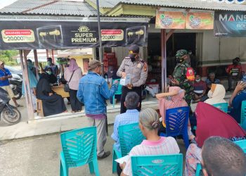 Jelang Akhir Tahun, Polsubsektor Pelalawan Bantu Pemerintah Genjot Capaian Vaksinasi