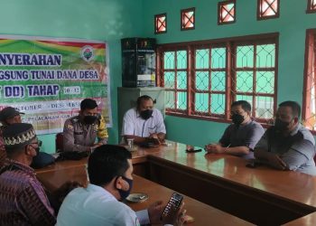 Bhabinkamtibmas Polsubsektor Pelalawan Lakukan Pengamanan Penyaluran BLT-DD