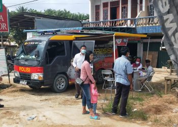 Satlantas Polsek Ukui dan Urkes Polres Pelalawan Gelar Vaksinasi dan Sim Keliling