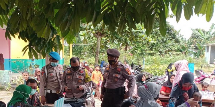 Polsek Bandar Sei Kijang Terus Bantu Proses Percepatan Vaksinasi, Berikut Datanya