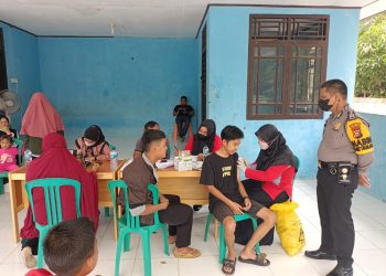 Tinjau Vaksinasi Anak dan Masyarakat Umum, Polsubsektor Pelalawan Lakukan Pengamanan